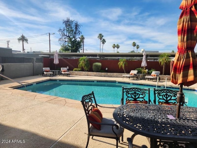 view of pool featuring a patio area