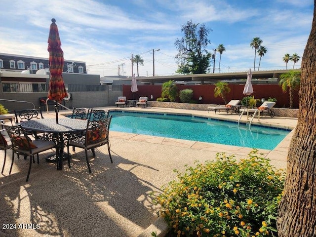 view of swimming pool featuring a patio