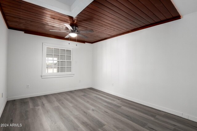 unfurnished room with hardwood / wood-style floors, ornamental molding, ceiling fan, and wooden ceiling