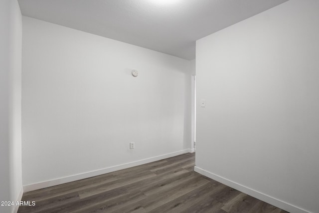 empty room featuring dark hardwood / wood-style floors