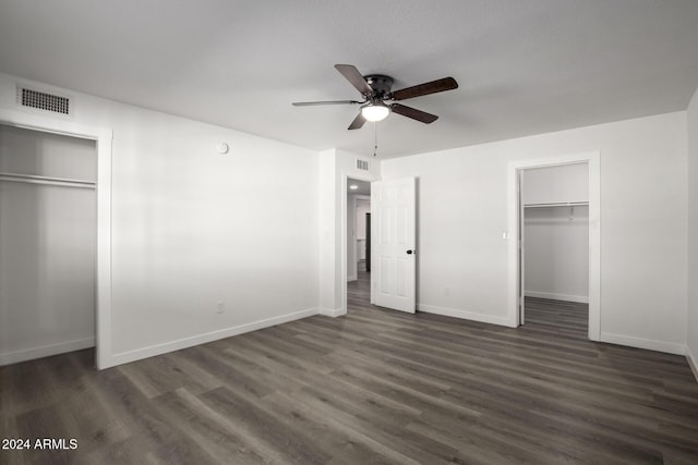 unfurnished bedroom with dark hardwood / wood-style floors and ceiling fan