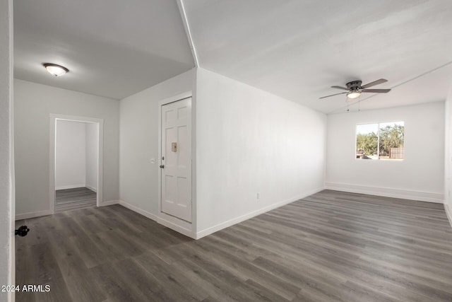 unfurnished room featuring dark hardwood / wood-style flooring and ceiling fan