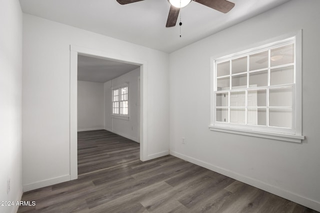 empty room featuring dark hardwood / wood-style floors and ceiling fan