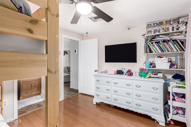 bedroom with hardwood / wood-style flooring and ceiling fan