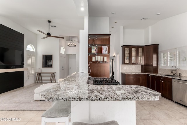 9100 E Captain Dreyfus Ave, Scottsdale, AZ 85260 - kitchen featuring dishwasher, a sink, a ceiling fan, light tile patterned flooring, and light stone countertops