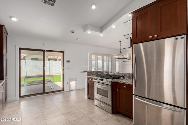 9100 E Captain Dreyfus Ave, Scottsdale, AZ 85260 - kitchen with appliances with stainless steel finishes, light stone counters, baseboards, light tile patterned flooring, and recessed lighting