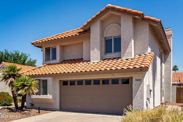 9100 E Captain Dreyfus Ave, Scottsdale, AZ 85260 - mediterranean / spanish-style home with a tiled roof, stucco siding, driveway, and a garage