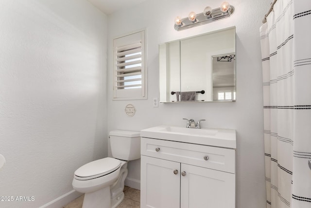 9100 E Captain Dreyfus Ave, Scottsdale, AZ 85260 - bathroom with baseboards, vanity, toilet, tile patterned floors, and curtained shower