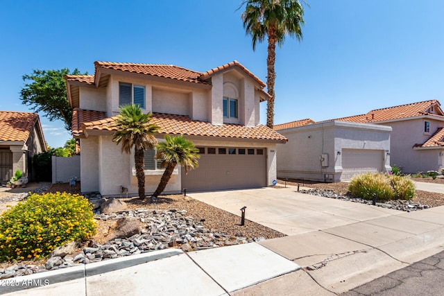 9100 E Captain Dreyfus Ave, Scottsdale, AZ 85260 - mediterranean / spanish-style home featuring a tiled roof, stucco siding, and concrete driveway
