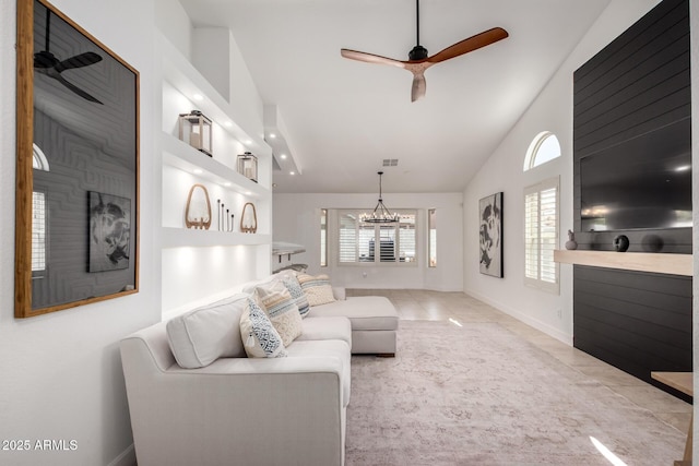 9100 E Captain Dreyfus Ave, Scottsdale, AZ 85260 - living room with ceiling fan, a chandelier, high vaulted ceiling, baseboards, and tile patterned floors