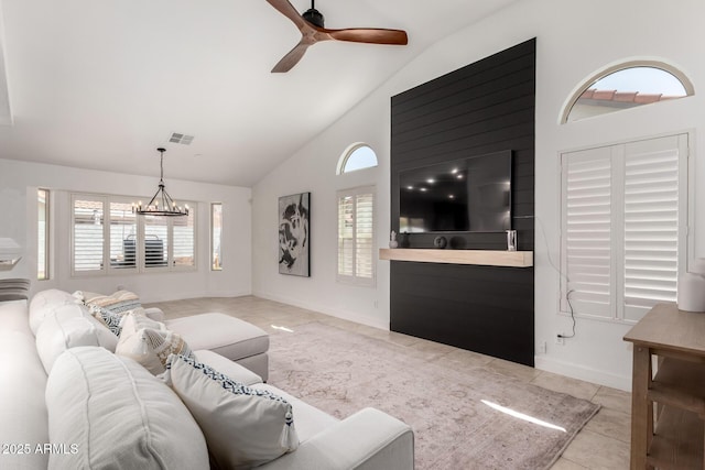 9100 E Captain Dreyfus Ave, Scottsdale, AZ 85260 - tiled living room featuring healthy amount of natural light, a ceiling fan, a chandelier, high vaulted ceiling, and baseboards