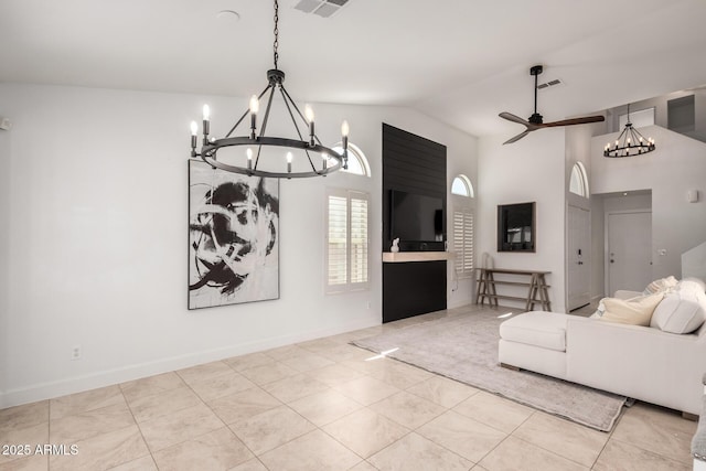 9100 E Captain Dreyfus Ave, Scottsdale, AZ 85260 - living area with a chandelier, light tile patterned floors, a ceiling fan, baseboards, and high vaulted ceiling
