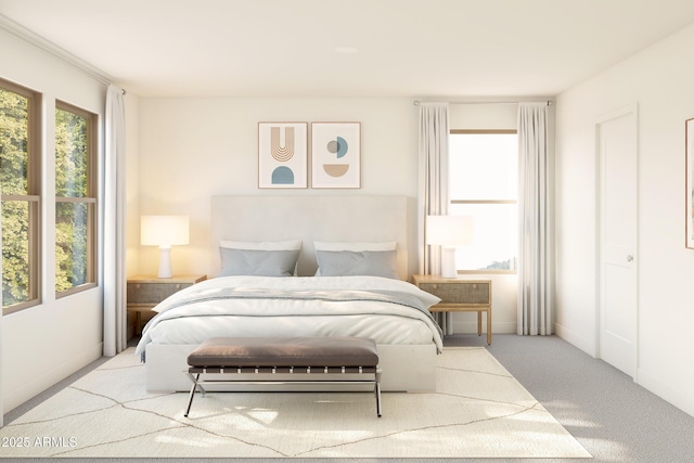 bedroom featuring baseboards and carpet