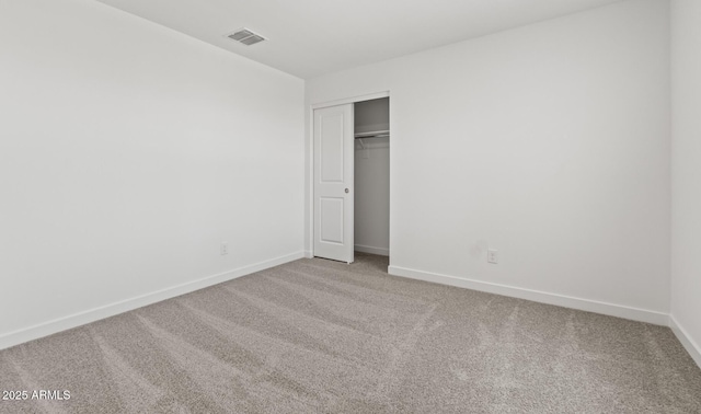 7420 S 76th Ln, Laveen, AZ 85339 - unfurnished bedroom with carpet floors, baseboards, and a closet