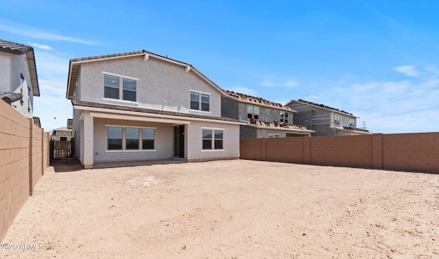 7420 S 76th Ln, Laveen, AZ 85339 - back of house featuring stucco siding and a fenced backyard