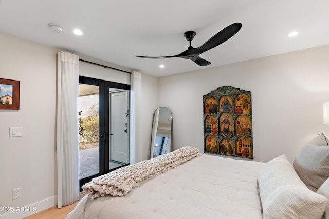 bedroom featuring ceiling fan, light wood-type flooring, and access to outside