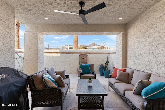 view of patio with ceiling fan, grilling area, and an outdoor hangout area