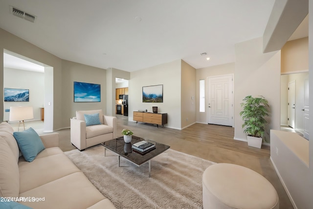 living room with light hardwood / wood-style flooring