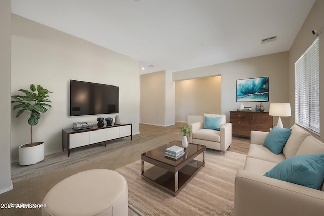 living room with light hardwood / wood-style floors