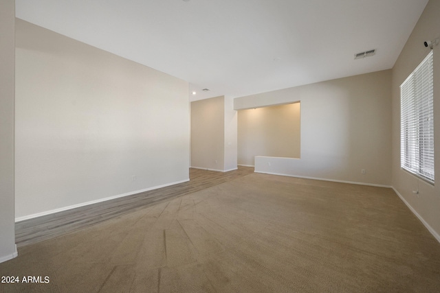 unfurnished room featuring carpet flooring