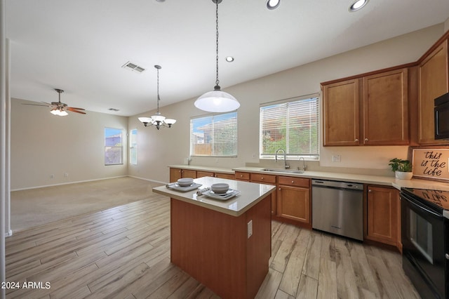 kitchen featuring a center island, black appliances, sink, light carpet, and pendant lighting