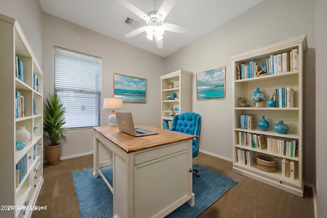 office area featuring dark colored carpet and ceiling fan