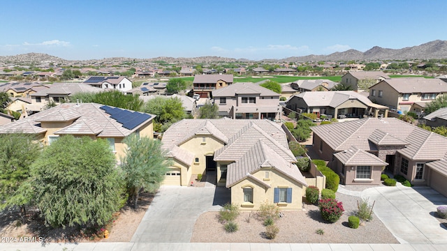 birds eye view of property featuring a mountain view