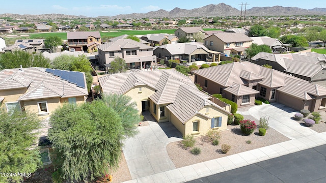 birds eye view of property with a mountain view