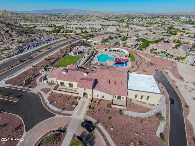 birds eye view of property featuring a mountain view