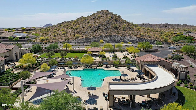 view of pool featuring a patio area and a mountain view