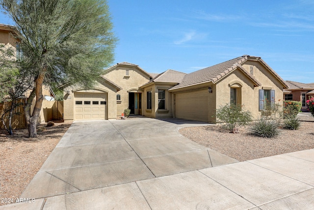 ranch-style house featuring a garage