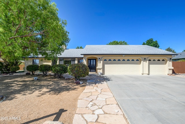 7133 E Pinnacle Pass Loop, Prescott Valley, AZ 86315 - ranch-style home featuring an attached garage, concrete driveway, stucco siding, and roof with shingles