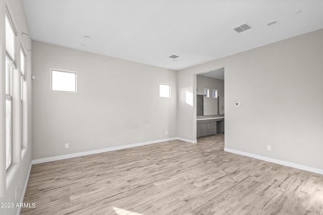 unfurnished room with light hardwood / wood-style flooring