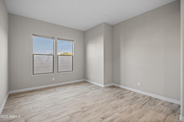 unfurnished room featuring light hardwood / wood-style flooring