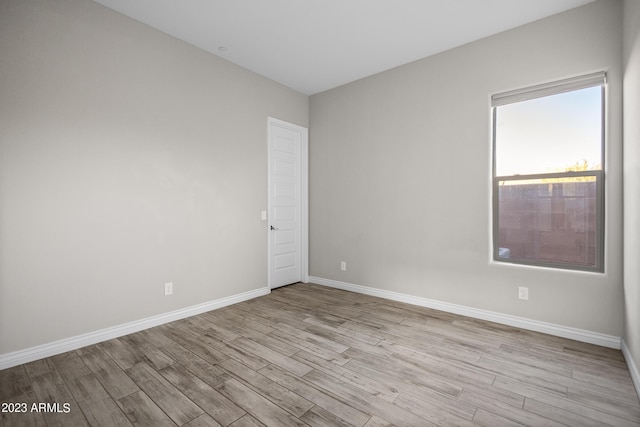 unfurnished room with light hardwood / wood-style flooring