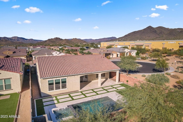 birds eye view of property featuring a mountain view