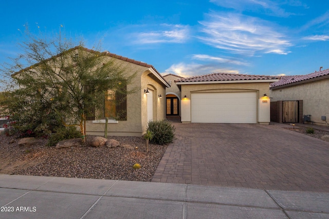 mediterranean / spanish-style house featuring a garage