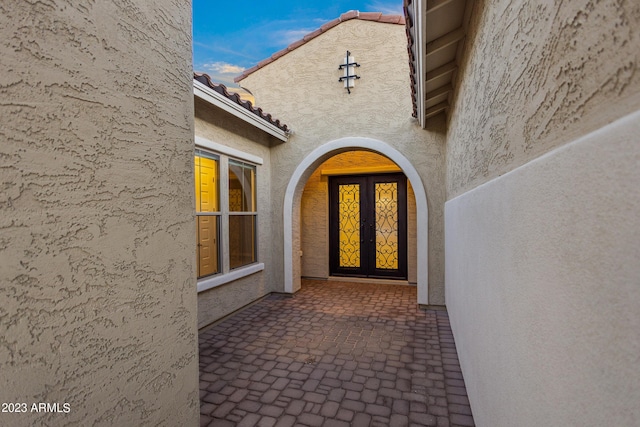 property entrance featuring french doors