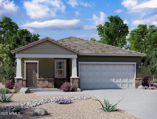 view of front of house with an attached garage, concrete driveway, and stucco siding