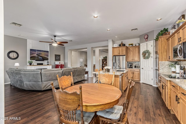 2045 E San Carlos Pl, Chandler, AZ 85249 - dining space featuring ceiling fan, dark wood-style flooring, and recessed lighting