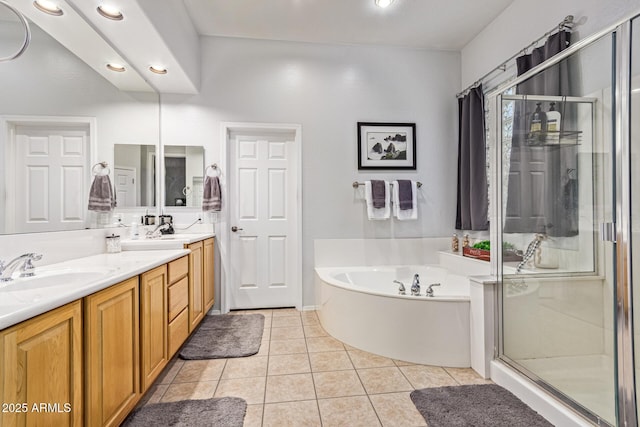 2045 E San Carlos Pl, Chandler, AZ 85249 - full bathroom featuring double vanity, a shower stall, a bath, tile patterned flooring, and recessed lighting