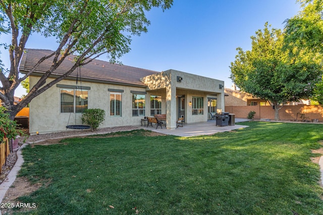 2045 E San Carlos Pl, Chandler, AZ 85249 - rear view of house featuring stucco siding, a tiled roof, and a patio