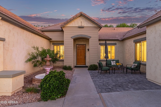 2045 E San Carlos Pl, Chandler, AZ 85249 - property entrance with outdoor lounge area, a patio, a tiled roof, and french doors