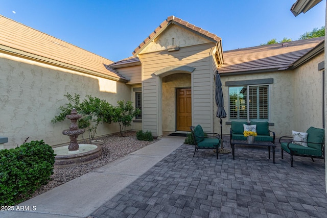 2045 E San Carlos Pl, Chandler, AZ 85249 - back of house featuring a patio, an outdoor hangout area, stucco siding, and a tile roof