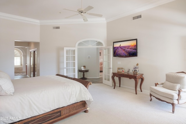 carpeted bedroom with french doors, ornamental molding, and visible vents