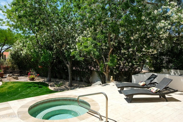 view of swimming pool featuring an in ground hot tub, fence, and a patio area