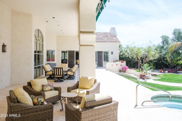 view of patio / terrace featuring outdoor lounge area and an outdoor pool