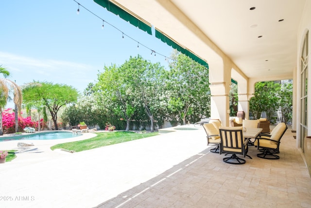 view of patio / terrace with an outdoor pool