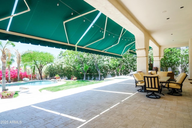surrounding community with outdoor dining area, a swimming pool, and a patio area