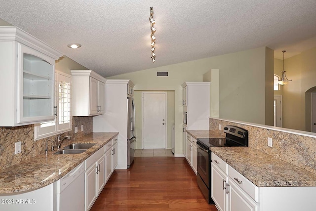 kitchen with dishwasher, sink, stainless steel fridge, black / electric stove, and white cabinetry